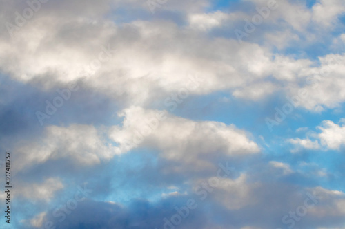 Blue sky with colorful storm clouds, background for design_ © Volodymyr