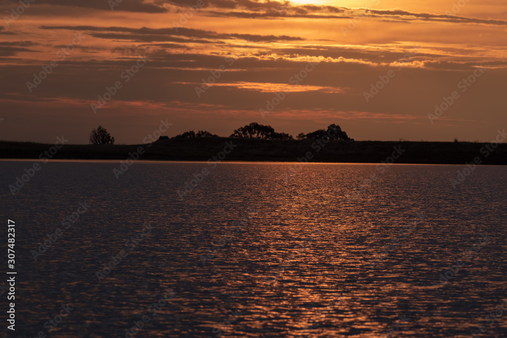 Golden Sun-set over dam in South Africa 