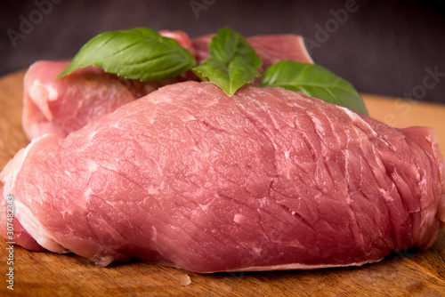  raw pork on a wooden board