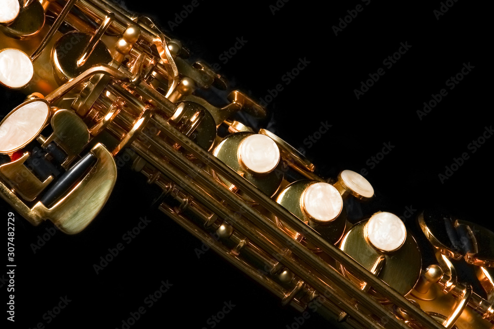 Naklejka premium soprano saxophone on black background