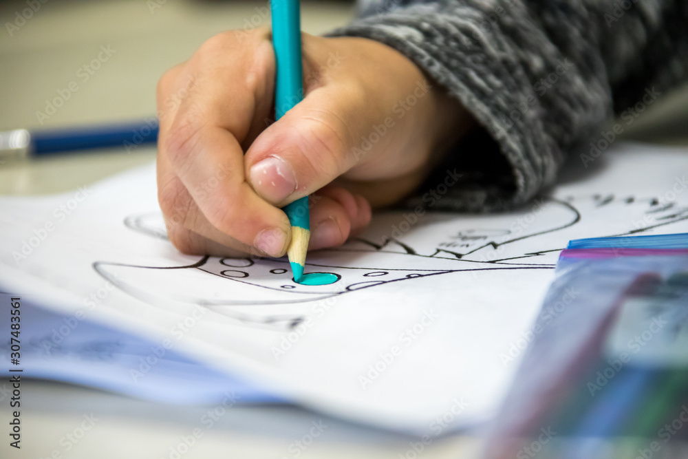 Kids learning and writing in school. Kids learning and writing in school.