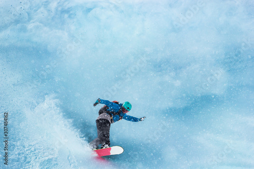 Snowboarder snowboarding in powder snow