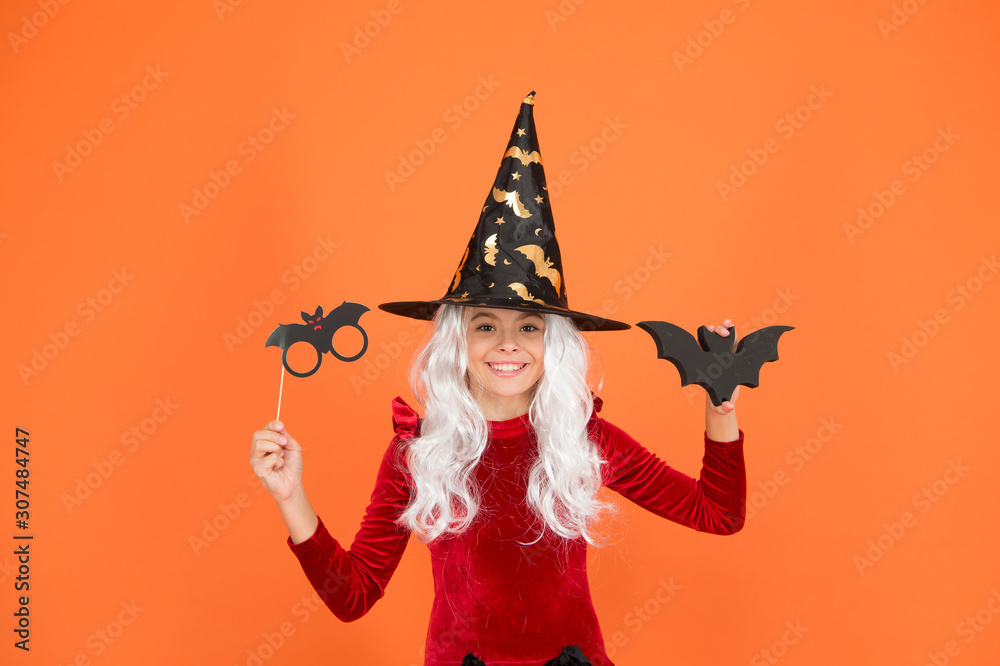 Photo booth props. Little child in witch costume. Magical spell. Small witch with white hair. Wizard or magician. Halloween party. Small girl in black witch hat. Autumn holiday. Join celebration Photo booth props. Little child in witch costume. Magical spell. Small witch with white hair. Wizard or magician. Halloween party. Small girl in black witch hat. Autumn holiday. Join celebration