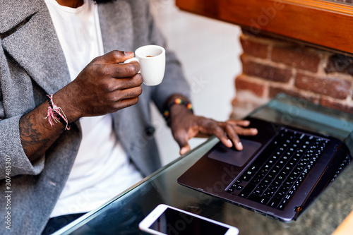 Close up of african man using computer photo