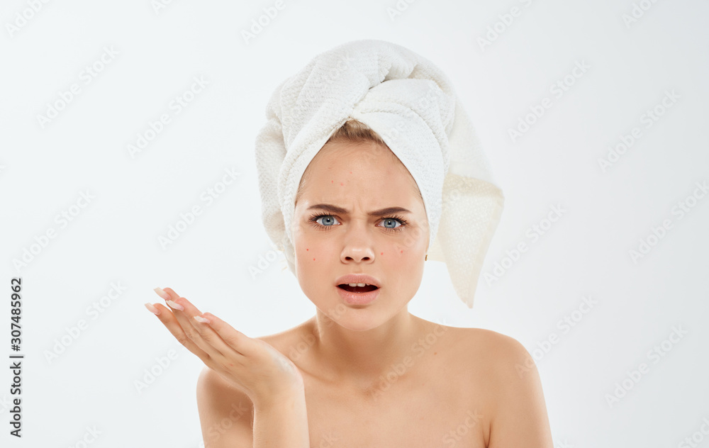 portrait of young woman with towel on her head portrait of young woman with towel on her head