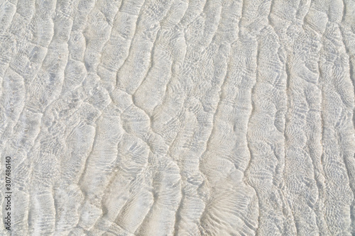 Shallow sea and white sand background