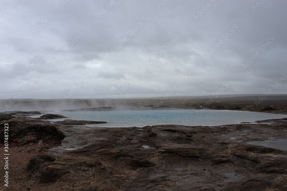 The original geysir in Iceland on a cloudy day