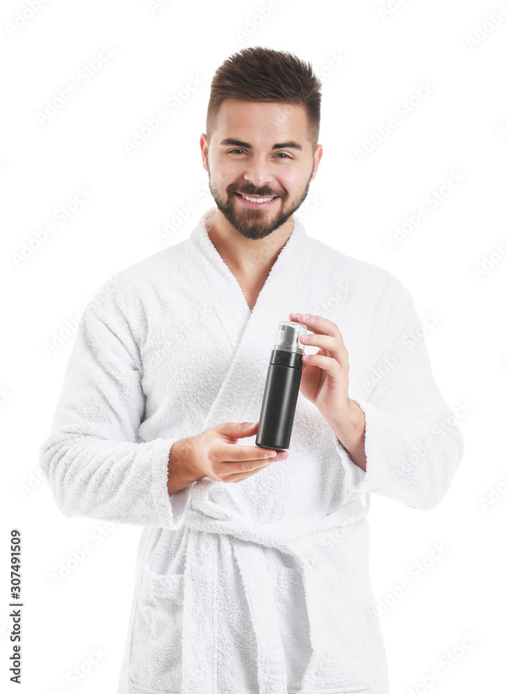 Handsome young man with cosmetic product on white background Handsome young man with cosmetic product on white background