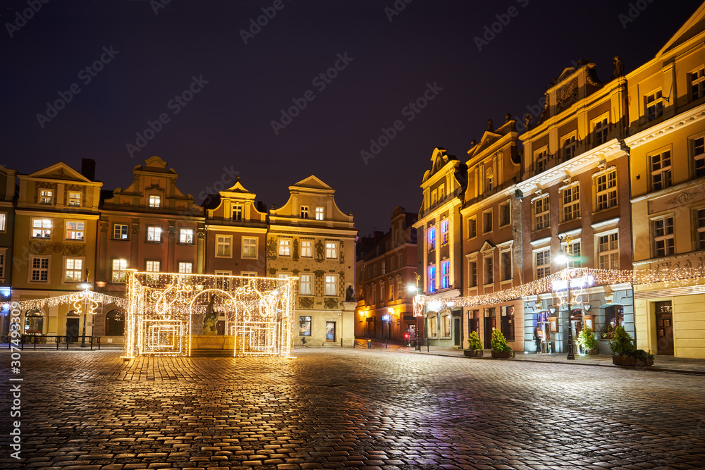 The Market Square with historic tenement houses andl and christmas decorations in city of Poznan.