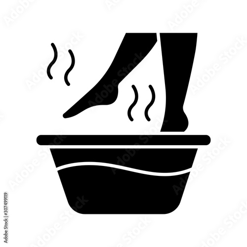 Foot bath glyph icon. Leg in hot water. Spa treatment. Common cold treatment. Healthcare and skincare. Wellness. Sickness help. Silhouette symbol. Negative space. Vector isolated illustration