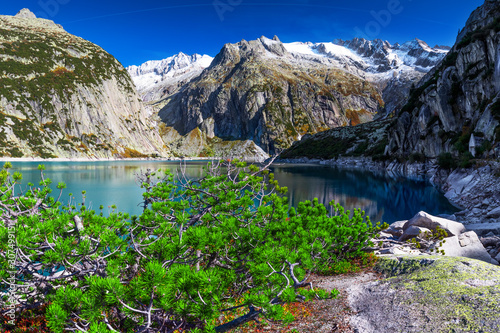 Gelmer Lake near by the Grimselpass in Swiss Alps, Gelmersee, Switzerland, Bernese Oberland, Switzerland. photo