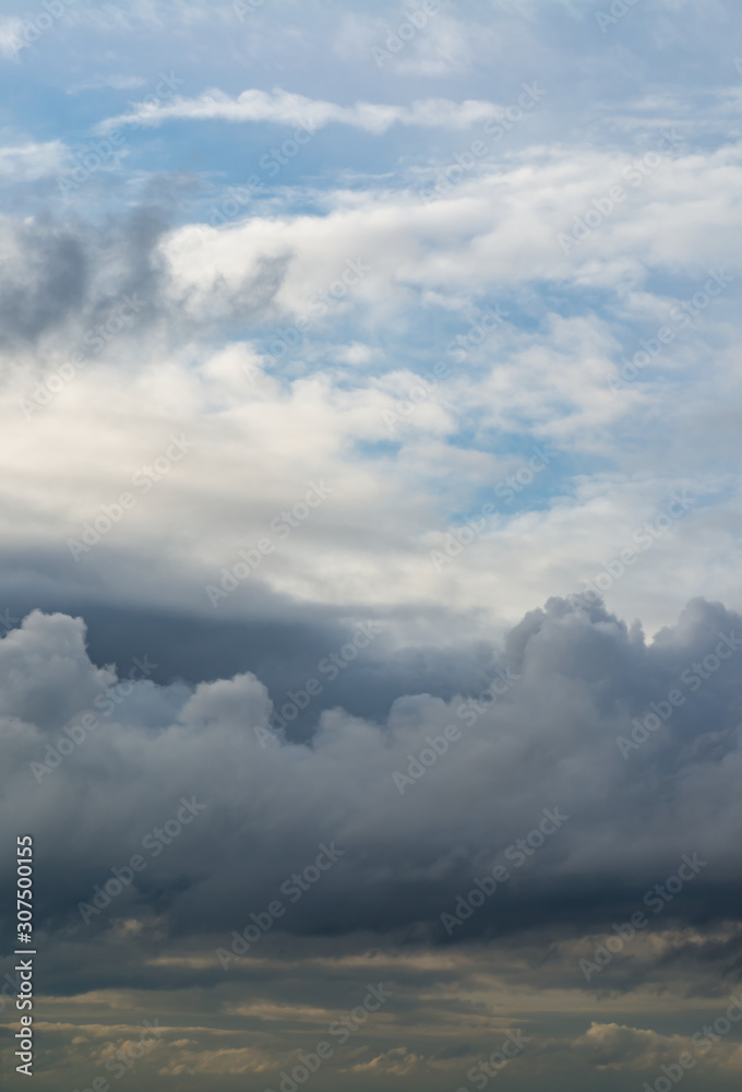 Fantastic clouds against blue sky, panorama