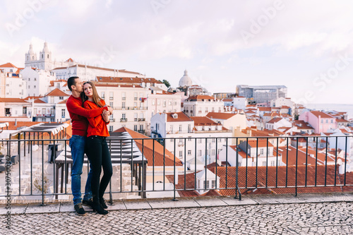 Lisbon, Portugal - 20 January, 2019. romantic couple hugs in red