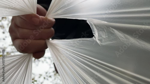 Man carrying bag with groceries view from inside of shopping bag