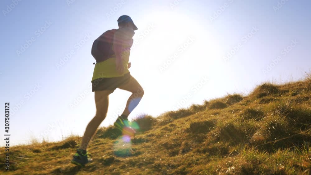 A man jogging up the hill in slow motion