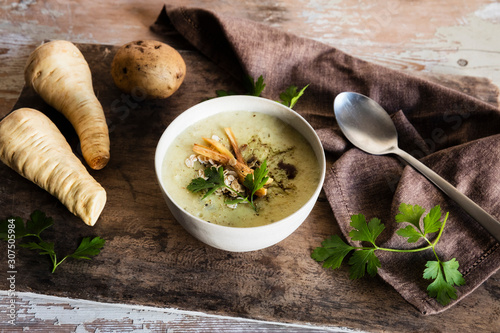 High angle view of oats soup served with ingredients on wooden table photo