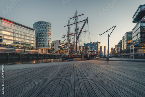 Ship at harbor against sky in HafenCity during sunset, Hamburg, Germany