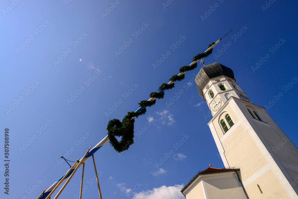 Low angle view of St. Benedikt church against blue sky during sunny day, Geretsried, Germany Low angle view of St. Benedikt church against blue sky during sunny day, Geretsried, Germany