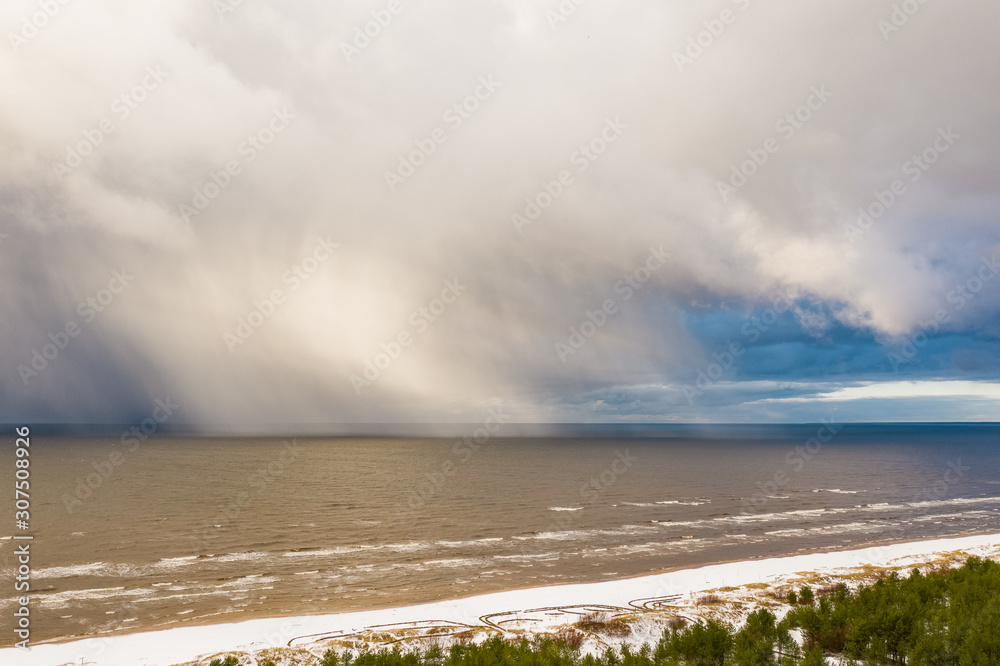 Heavy snowfall at Baltic sea with huge white clouds Heavy snowfall at Baltic sea with huge white clouds