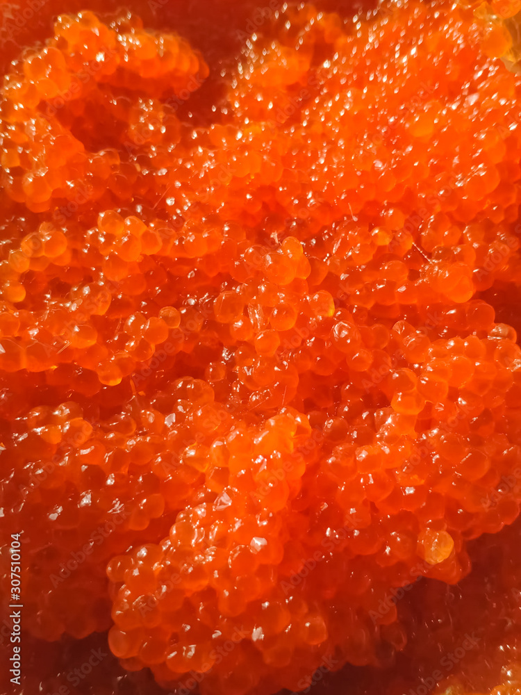 red caviar in plastic container. Salmon caviar, diet food. red caviar in plastic container. Salmon caviar, diet food.