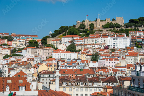 Lisbon cityscape with Sao Jorge Castle against sky in Portugal