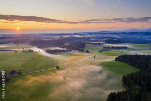 Scenic view of landscape against sky during sunrise at Dietramszell, T?lzer Land, Upper Bavaria, Bavaria, Germany photo