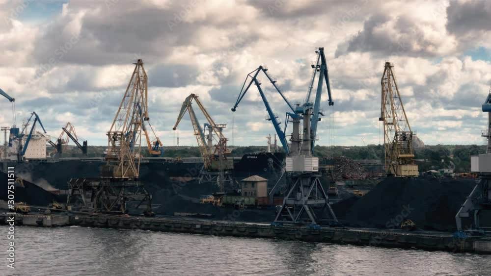 Bitumen Ship and Cargo and Cranes in Riga Port - Latvia Bitumen Ship and Cargo and Cranes in Riga Port - Latvia