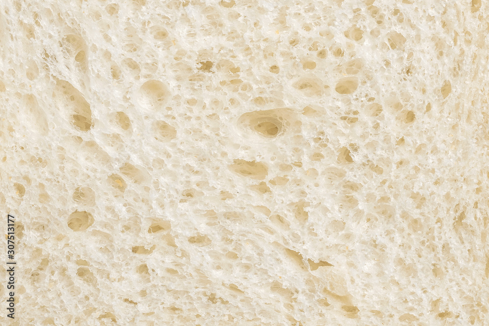 Sliced wheaten bread texture. Flat lay, top view, close-up