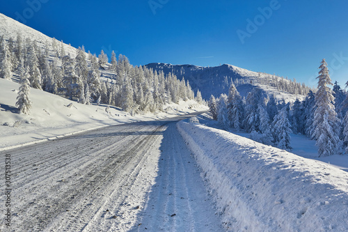 Winter. The mountains. Road, descent from the pass