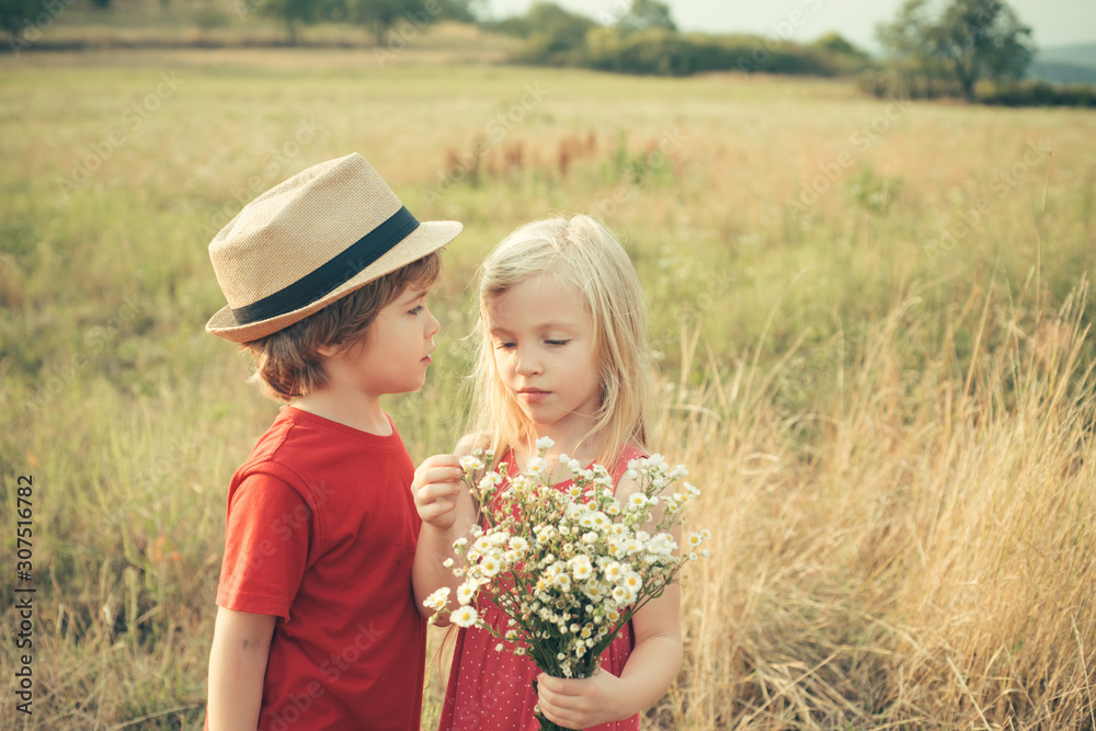 Romantic and love. Summer portrait of happy cute child. Beautiful little  couple - boy and girl embracing. Happy Valentines day. The concept of child  friendship and kindness. Childhood on countryside. Stock Photo |