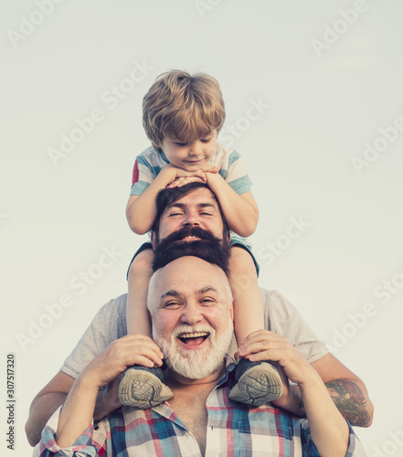 Childhood concept. Family holiday and togetherness. Male multi generation family. photo