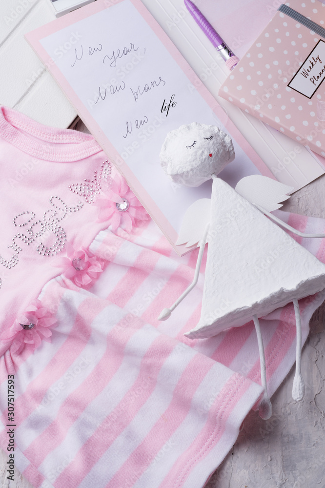 set of woman plans at new year with angel and child dress. concept shot. close up set of woman plans at new year with angel and child dress. concept shot. close up