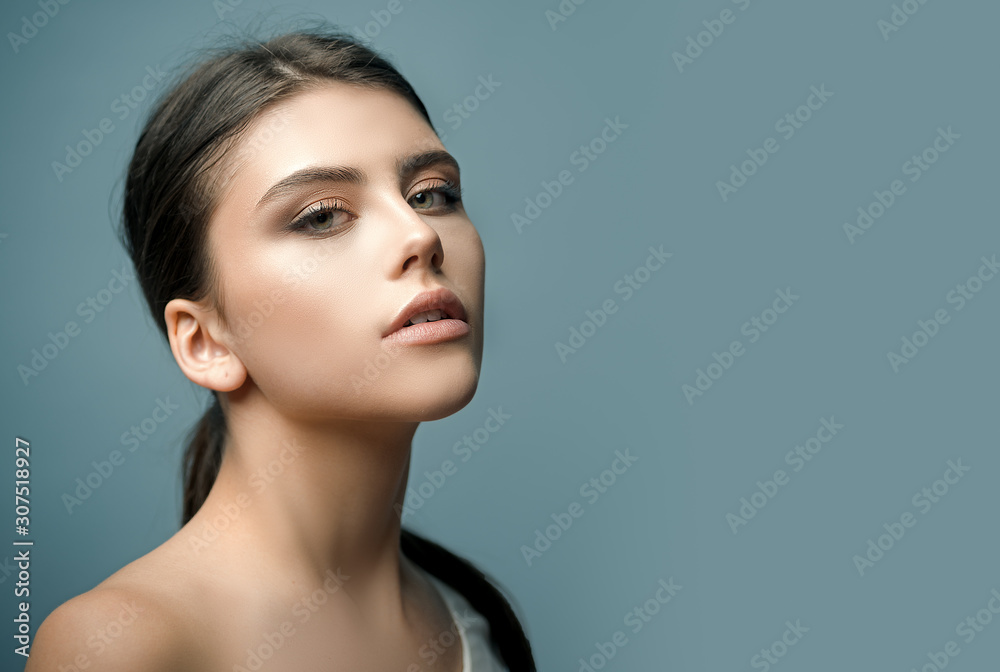 Portrait of a beautiful woman in a white blouse. Fashionable youth style. Young woman posing. Monochrome beautiful woman face healthy hair and skin beautiful model portrait. Portrait of a beautiful woman in a white blouse. Fashionable youth style. Young woman posing. Monochrome beautiful woman face healthy hair and skin beautiful model portrait.