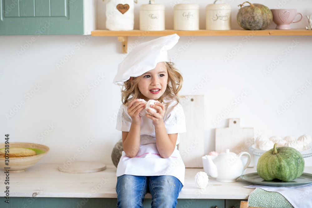 happy little chef girl playing in kitchen at home happy little chef girl playing in kitchen at home