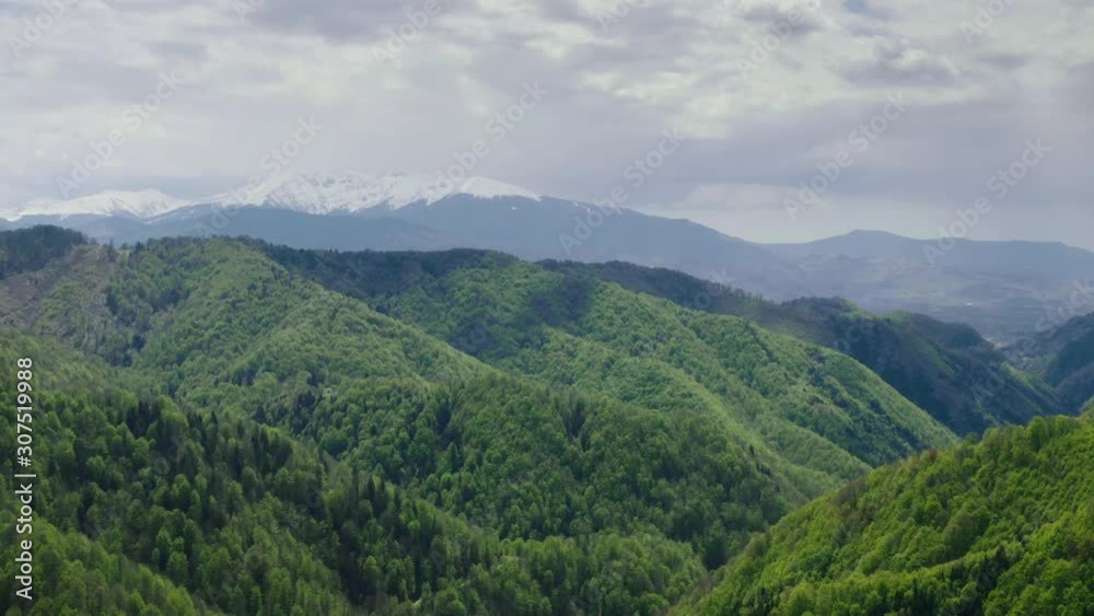 Flying above beautiful forest with small river and alpine pastures from Transylvania – Romania. Flying above beautiful forest with small river and alpine pastures from Transylvania – Romania.
