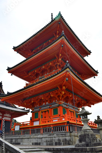 Kyoto, Japan - May 21 2017: Bright orange red shrine at the entrance of the Kiyomizu-dera temple