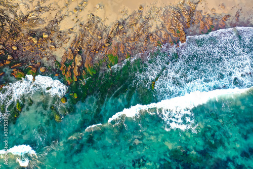 Waves rolling into the rocky coastline of Crystal Cove in Newport Beach 