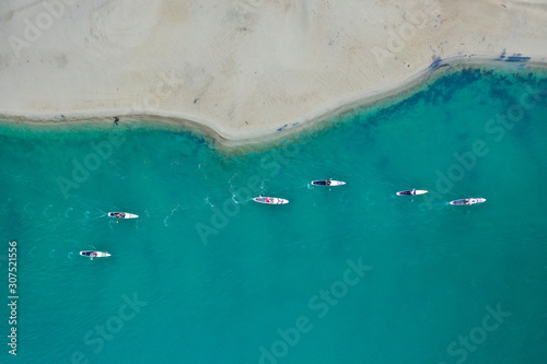 Dana Point Harbor Sandbar with paddle boarders