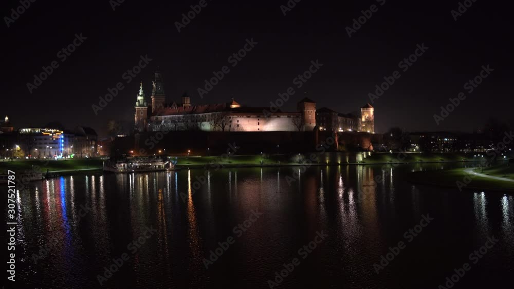 Royal Wawel Castle illuminated at night reflecting in the Vistula river, Krakow - Poland 4K Royal Wawel Castle illuminated at night reflecting in the Vistula river, Krakow - Poland 4K