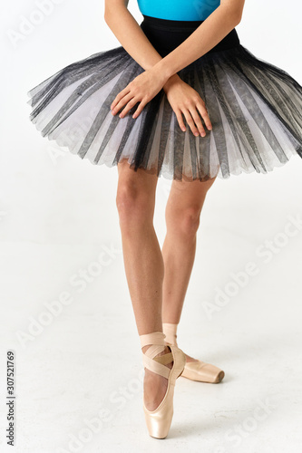 legs of young woman in black dress