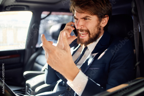 businessman talking on phone in car © SHOTPRIME STUDIO