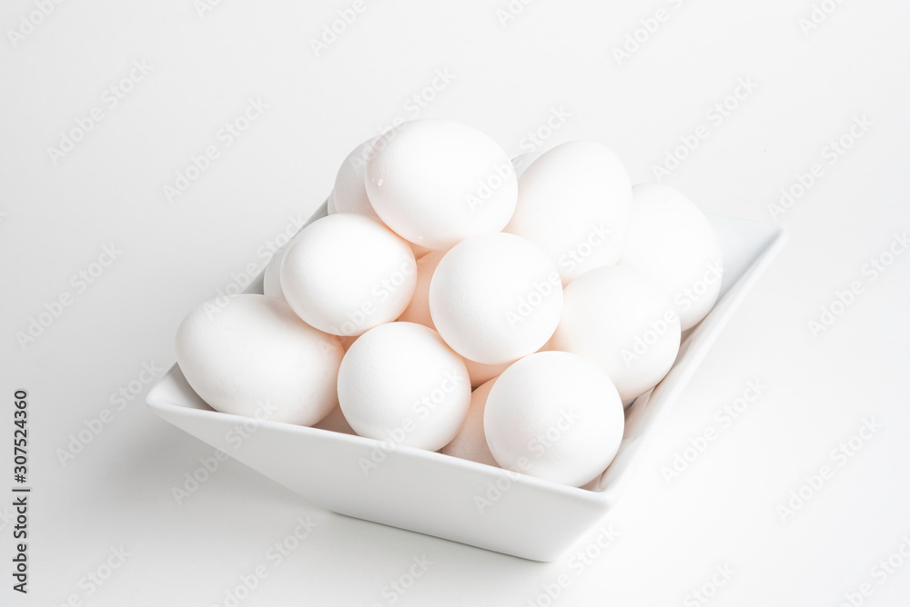 Fresh White Eggs Piled On White Square Bowl Fresh White Eggs Piled On White Square Bowl