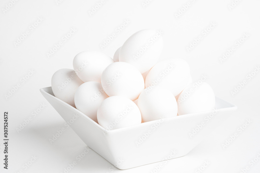 Fresh White Eggs Piled On White Square Bowl Fresh White Eggs Piled On White Square Bowl