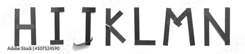 Wallpaper Mural HIJKLMN letters with black plastic on white background Torontodigital.ca