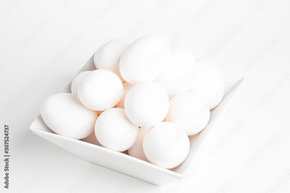 Fresh White Eggs Piled On White Square Bowl Fresh White Eggs Piled On White Square Bowl