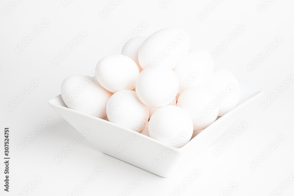 Fresh White Eggs Piled On White Square Bowl Fresh White Eggs Piled On White Square Bowl