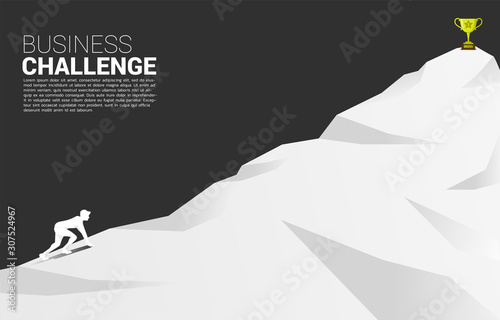silhouette of businessman ready to run to trophy at top of mountain. Concept of vision mission and goal of business