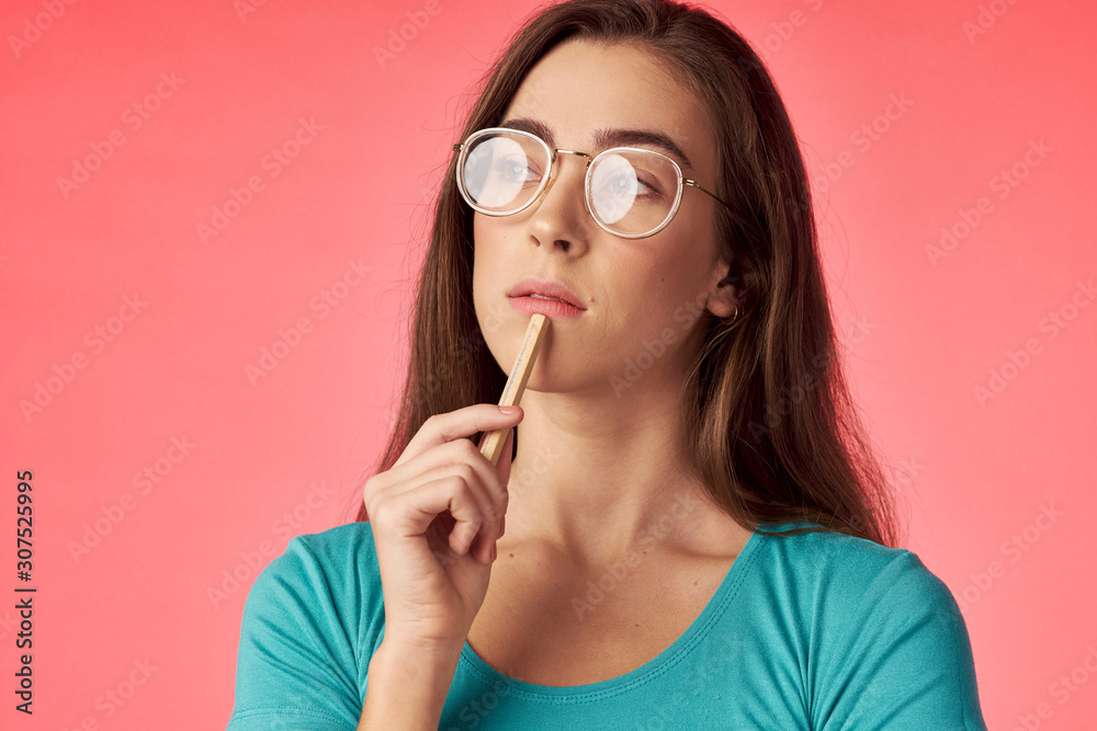 young woman with finger on her lips young woman with finger on her lips