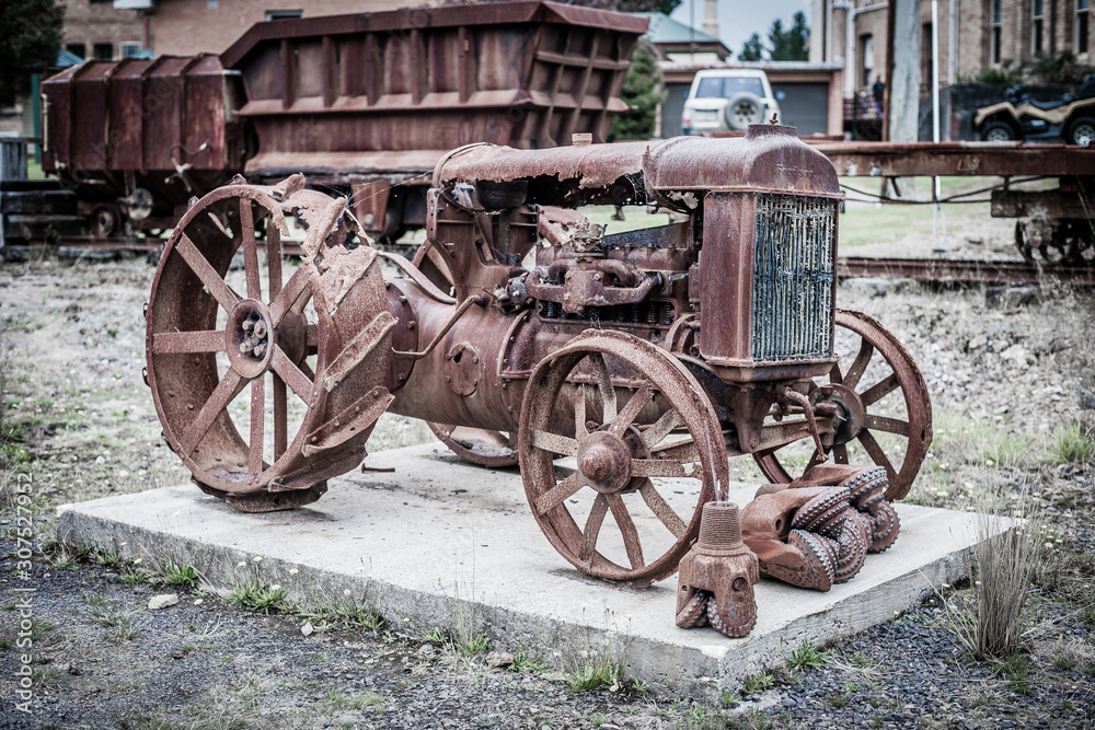 old tractor in yard with rust and corrosion