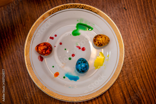 Plate white easter quail eggs.